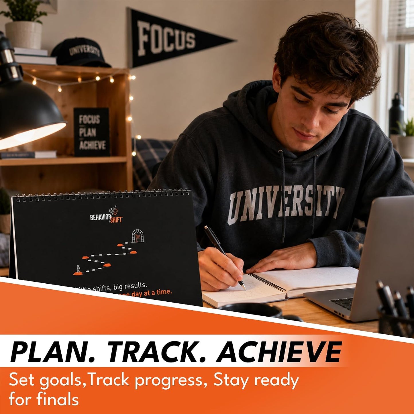 College student using the Behavior Shift Student Success Calendar while studying at a desk with a laptop and notebook.